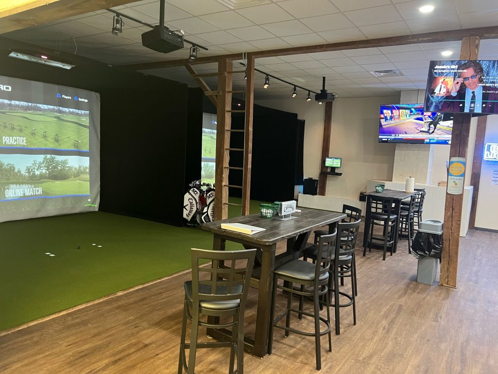 view of simulator with high top tables